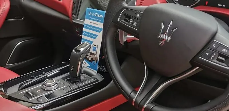 Luxury car interior with red accents