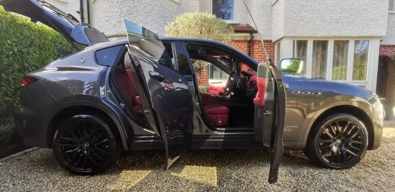 Luxury car with open doors