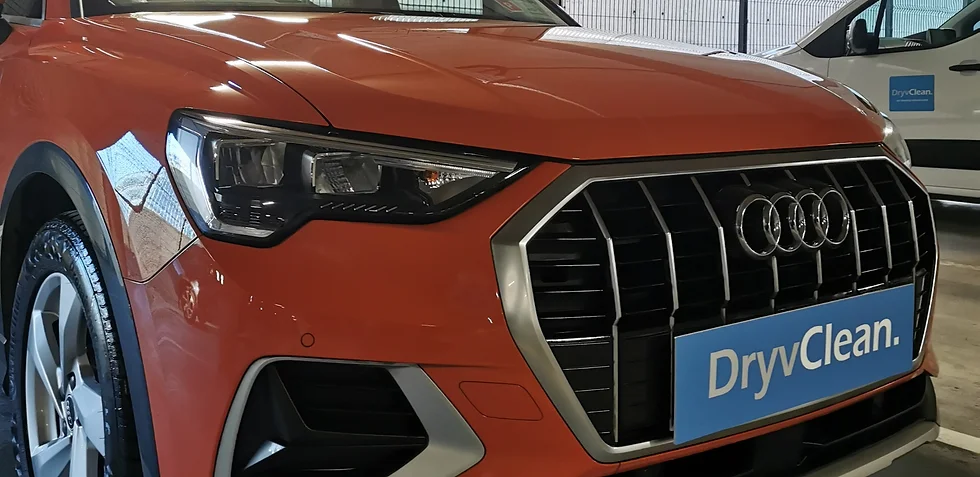 Orange Audi with DryClean signage