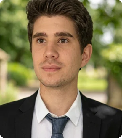 Young man in suit outdoors.